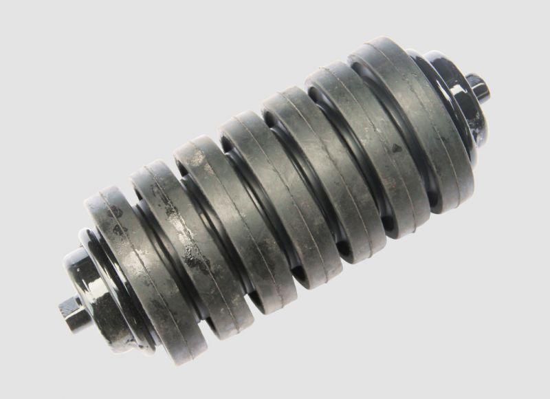 Heavy-duty impact idler equipped with rubber rings to absorb shock and protect the conveyor belt at loading points