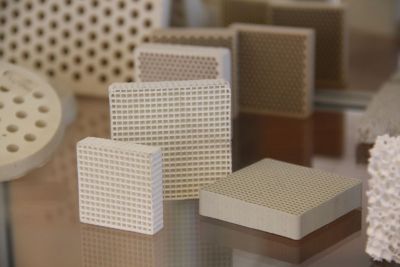 Industrial product display showcasing various sizes and configurations of ceramic cell and honeycomb foundry filters