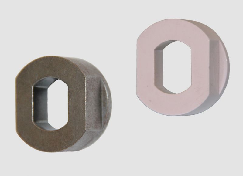 Selection of plastic and metal push-on axle end caps used as adapters for mounting conveyor idler shafts into framework slots