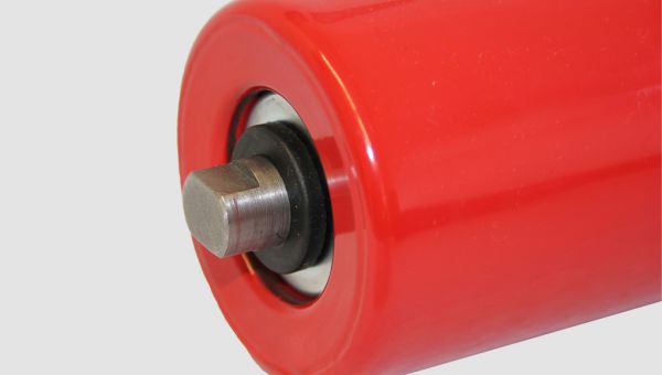 Close-up view of a red standard conveyor roller type 15207 showing the flat shaft end