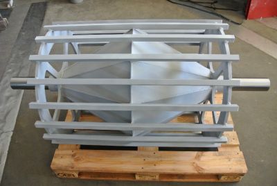 Industrial cage drum for conveyor systems, fully displayed and packed on a pallet for transport