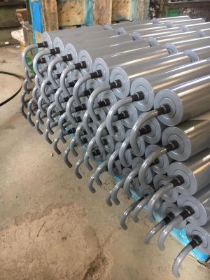 Multiple spring-suspended garland roller stations stacked and prepared for logistics and industrial conveyor upgrades