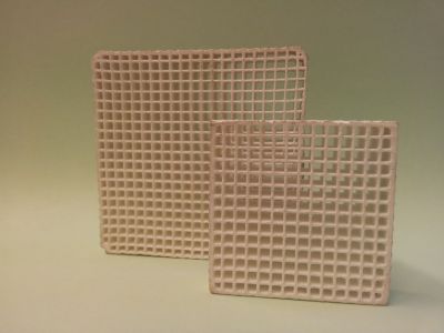 Two ceramic cell filters showing sharp, square-patterned honeycomb grids for efficient non-metallic inclusion trapping
