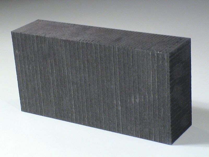 Single rectangular graphite mold block displaying fine surface texture, used for high-temperature foundry casting applications