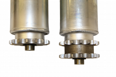 Top-down view of single and double sprockets on motorized conveyor rollers, showcasing alignment and tooth spacing for chain drives